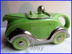 Ancienne voiture anglaise Art Déco, céramique verte craquelée servant de théière Ancienne voiture anglaise Art Déco, céramique verte craquelée servant de théière