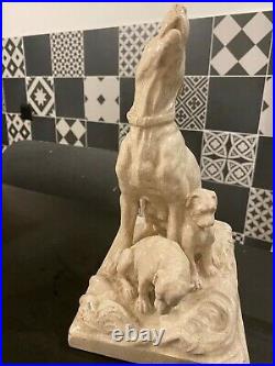 Ceramique craquelee représentant un chien avec son chiot signé EM. SAMSON
