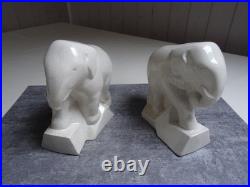 Serre- livres, art déco, éléphants trompe enroulée, céramique craquelée ivoire