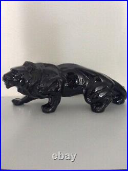 Statue animalière en céramique émaillée noir lion de Saint Clément Art Déco