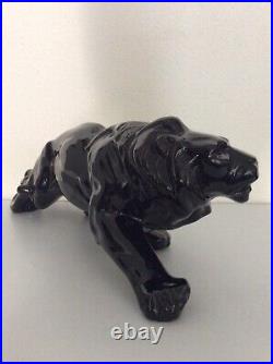 Statue animalière en céramique émaillée noir lion de Saint Clément Art Déco