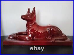 Statue chien berger allemand en céramique émaillée rouge Saint Clément Art Déco